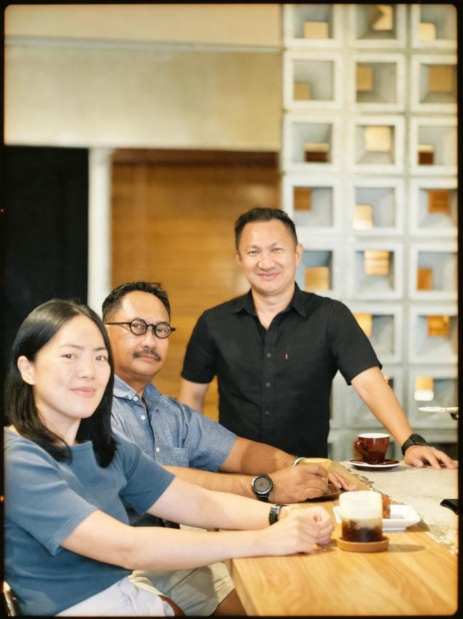 HMR Konsultan's directors together over coffee.